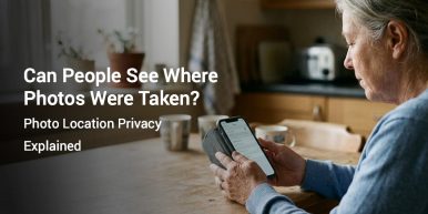 Person checking location permission settings on a smartphone at a kitchen table